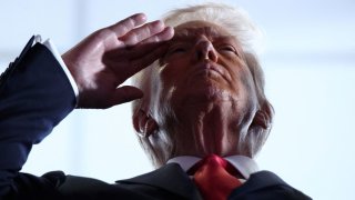 Football – NFL – Super Bowl LIX – Philadelphia Eagles v Kansas City Chiefs – Caesars Superdome, New Orleans, Louisiana, United States – February 9, 2025 U.S. President Donald Trump salutes before the game 