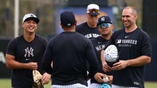 Anthony Volpe #11, Jasson Domínguez #24 and Paul Goldschmidt #48 of the New York Yankees talk during spring training at George M. Steinbrenner Field on Feb. 19, 2025 in Tampa, Florida. 