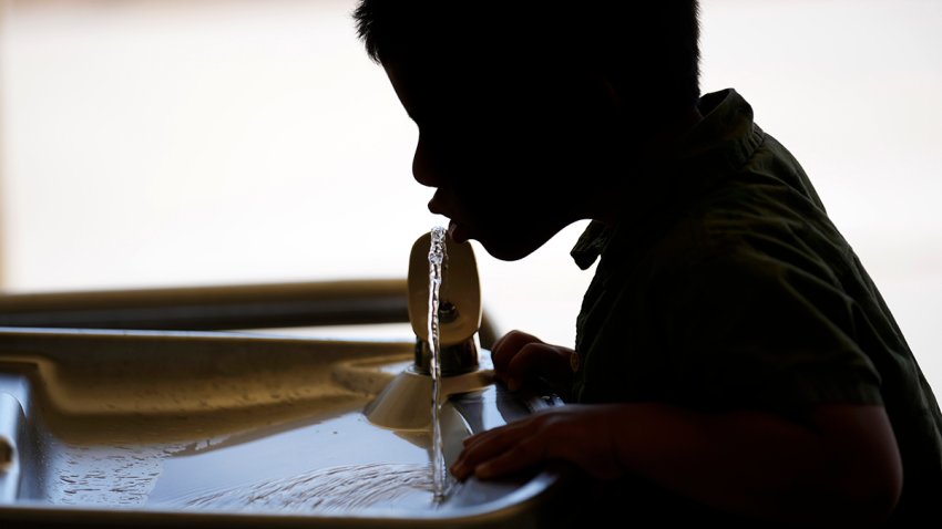 FILE - A student drinks from a water fountain at an elementary school in California, Sept. 20, 2023.