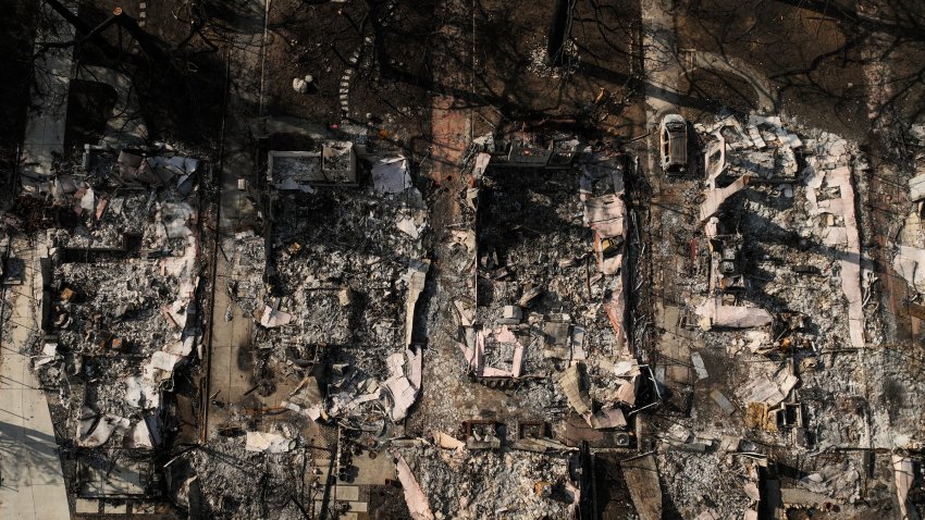 An aerial photo shows the charred homes of Louise Hamlin, center left, and Chris Wilson, center right, after the Eaton Fire in Altadena, Calif., Thursday, Jan. 30, 2025.