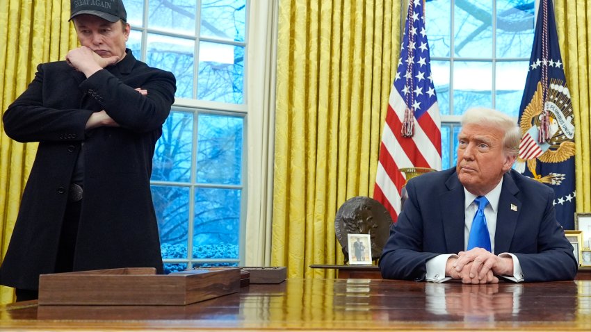 Elon Musk listens as President Donald Trump speaks with reporters in the Oval Office at the White House, Tuesday, Feb. 11, 2025, in Washington.