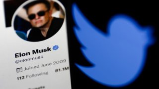 Elon Musk’s Twitter profile displayed on a computer screen and Twitter logo displayed on a phone screen are seen in this illustration photo taken in Krakow, Poland on April 9, 2022.