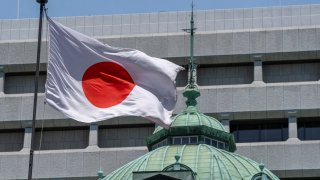 Japan’s national flag flutters at the Bank of Japan headquarters in Tokyo on May 30, 2024.