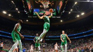 Jayson Tatum #0 of the Boston Celtics rebounds the ball against the Dallas Mavericks during Game 5 of the 2024 NBA Finals on June 17, 2024 at the TD Garden in Boston.