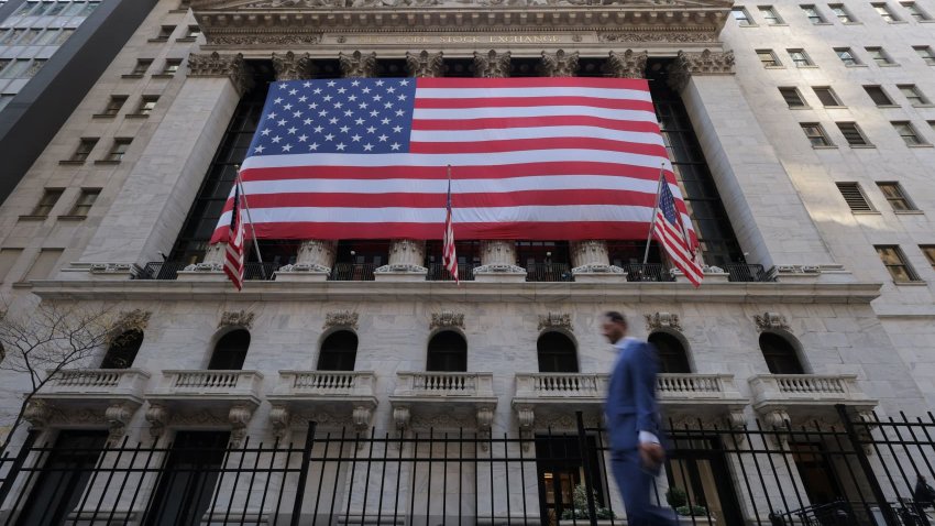 U.S. flags hang on the building of the New York Stock Exchange (NYSE), after U.S. President-elect Donald Trump won the presidential election, in New York City, U.S., November 6, 2024. 