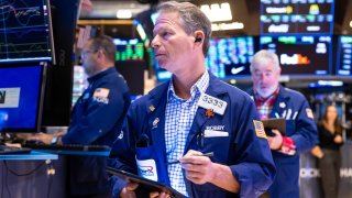 Traders work on the floor of the New York Stock Exchange on Nov. 22, 2024.