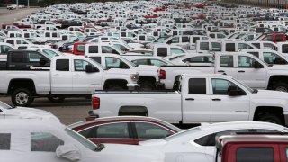 New trucks crowd a parking lot at the GM assembly plant in Oshawa, Ontario, Canada, on Sept. 24, 2019.