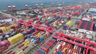 A drone view shows containers and cargo ships at a port in Wuhu, Anhui province, China, on Feb. 4, 2025.