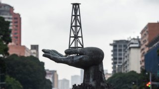 View of the Peace Monument sculpture in front of the Petroleos de Venezuela (PDVSA) headquarters in Caracas, on December 2, 2022.