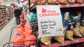 A “Shop Canadian” sign is seen at the entrance of a supermarket in Vancouver, British Columbia, Canada, March 4, 2025.