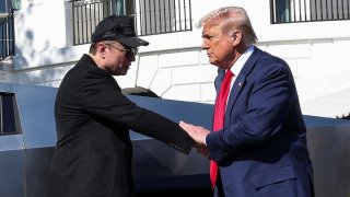 U.S. President Donald Trump and Tesla CEO Elon Musk shake hands in front of a Tesla Cybertruck, at the White House in Washington, D.C., U.S., March 11, 2025. 