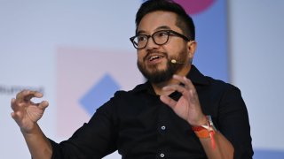Speakers from left, Brett Gibson, Initialized Capital; Jen Wolf, Initialized Capital; Garry Tan, Initialized Capital, on Venture stage during day one of Web Summit 2022 at the Altice Arena in Lisbon, Portugal.