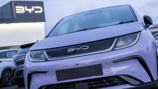 Brand new unregistered BYD electric cars are displayed for sale outside a BYD dealership, on February 20, 2025 in Bristol, England.