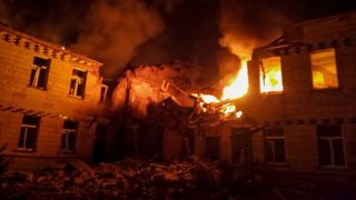 Officials work at the site of destruction and fire after the Russian attack in Sumy, Ukraine on March 19, 2025.