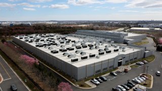 A car drives past a building of the Digital Reality Data Center in Ashburn, Virginia, U.S., March 17, 2025. 