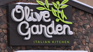The Olive Garden logo is displayed on the front of an Olive Garden Italian restaurant in Edmonton, Alberta, Canada, on February 15, 2025.