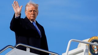 U.S. President Donald Trump gestures, as he boards Air Force One to depart for New Jersey at Joint Base Andrews, Maryland, U.S., March 21, 2025. 