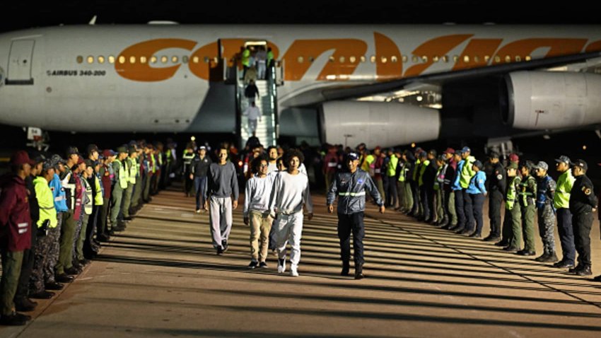 Venezuelan migrants deported from the United States and stranded in Honduras disembark from a Conviasa Airlines plane upon arrival at Simon Bolivar International Airport in Maiquetia, Venezuela on March 24, 2025. 