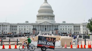 A mobile billboard rolls past the U.S. Capitol on May 10, 2023.