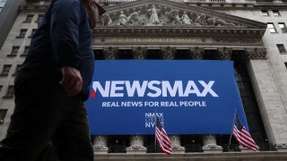 A banner for Newsmax Inc. is displayed during the company’s IPO at the New York Stock Exchange (NYSE) in New York City, U.S., March 31, 2025. 