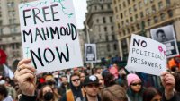 People gather outside of a New York court to protest the arrest and detention of Mahmoud Khalil