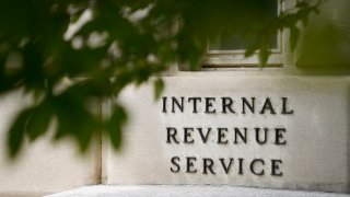 FILE - The sign outside the Internal Revenue Service building is seen. May 4, 2021, in Washington.