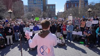 People listen to Griffin Gowdy, a PhD student at Columbia University,