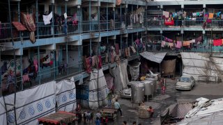 Displaced Palestinians lives in a school run by UNRWA