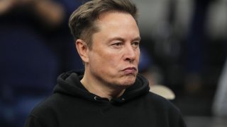 Elon Musk attends the finals at the NCAA wrestling championship, Saturday, March 22, 2025, in Philadelphia. (AP Photo/Matt Rourke)