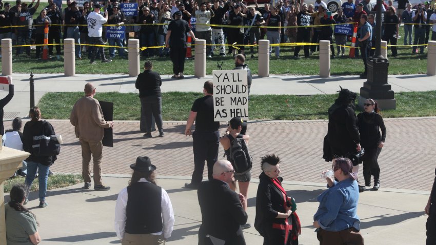 Christians counter-protest at a rally held outside the Kansas Statehouse