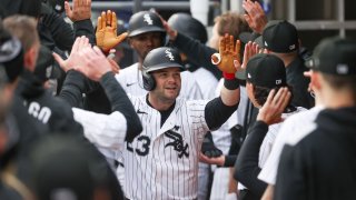 CHICAGO, IL – MARCH 27: Andrew Benintendi #23 of the Chicago White Sox celebrates with teammates in the dugout after hitting a three-run home run in the eighth inning during the game between the Los Angeles Angels and the Chicago White Sox at Rate Field on Thursday, March 27, 2025 in Chicago, Illinois. (Photo by Griffin Quinn/MLB Photos via Getty Images)