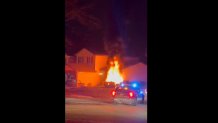 Vehicle engulfed in flames after crashing into a home.