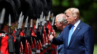 U.S. President Donald Trump inspects a Guard of Honour at Buckingham Palace on June 3, 2019, in London.