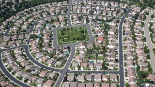 A new housing development built along a canal near the Mokelumne River is viewed on May 22, 2023, near Stockton, California.