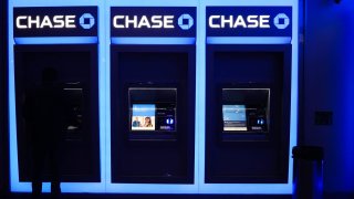 A person uses an ATM at a Chase bank in New York City on November 19, 2024.