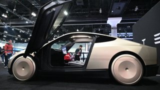 Tesla’s Cybercab robotaxi is displayed during the AutoMobility LA 2024 auto show at the Los Angeles Convention Center in Los Angeles, November 21, 2024.