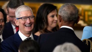 Apple CEO Tim Cook greets former President Barack Obama at the inauguration of U.S. President Donald Trump at the U.S. Capitol Rotunda in Washington, D.C., on Jan. 20, 2025.
