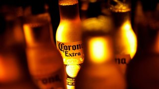 Bottles of Corona beer, the flagship brand of Grupo Modelo are displayed in this illustration taken in Monterrey, Mexico, February 18, 2025. 
