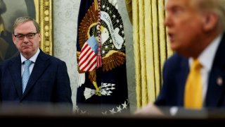 White House economic adviser Kevin Hassett stands next to U.S. President Donald Trump in the Oval Office of the White House in Washington, D.C., U.S., March 7, 2025. 