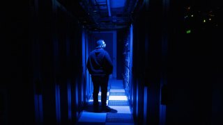 A visitor observes a computer bay at the PA10 data center, operated by Equinix Inc., in Paris, France, on Thursday, Feb. 6, 2025.