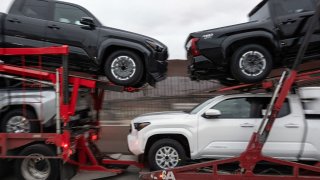 A cargo truck loaded with new pickups heads to U.S. at the Otay Commercial crossing in Tijuana, Baja California state, Mexico on March 27, 2025.