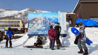 Skiers and snowboarders at Niseko Tokyu Grand Hirafu ski resort in Kutchan, Hokkaido Prefecture, Japan.