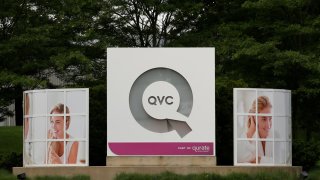 FILE PHOTO: Signage is displayed at the entrance to the QVC Studio Park in West Chester, Pennsylvania, U.S., June 4, 2018. 