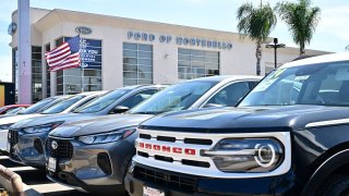 Vehicles seen on the lot of a Ford auto dealership in Montebello, California on April 1, 2025.