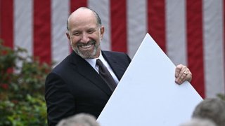US Secretary of Commerce Howard Lutnick holds a chart as unseen US President Donald Trump delivers remarks on reciprocal tariffs during an event in the Rose Garden entitled “Make America Wealthy Again” at the White House in Washington, DC, on April 2, 2025.