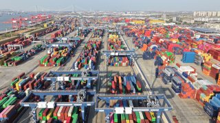 An aerial view of containers sitting stacked at Nanjing Port Longtan Container Terminal in Nanjing, Jiangsu Province of China, on March 17, 2025.