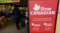 Close-up of ‘Shop Canadian’ poster displayed in a local storefront in Edmonton, Alberta, Canada, on April 4, 2025.
