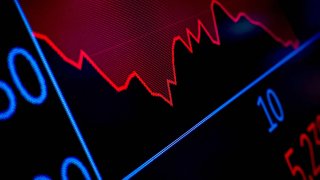 FILE PHOTO: A screen tracks trading on the floor at the New York Stock Exchange (NYSE) after the closing bell in New York City, U.S., April 4, 2025. 