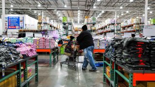 People shop in Bayonne, New Jersey on April 8, 2025.