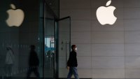 A person walks out of an Apple store in Beijing, China, on April 9, 2025.